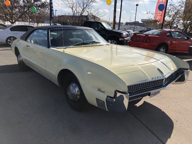 1967 Yellow Oldsmobile Toronado --