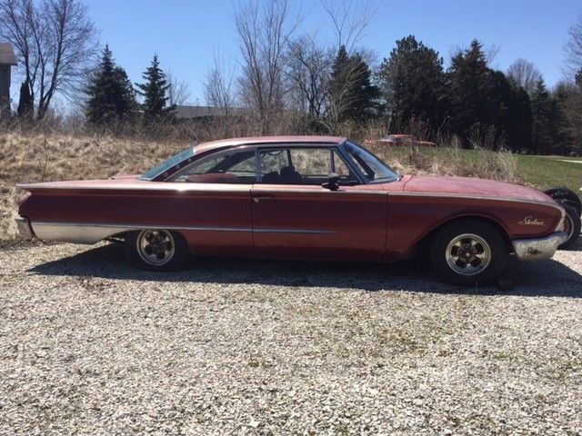 1960 Red Ford Starliner Coupe