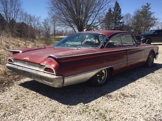 1960 Red Ford Starliner Coupe