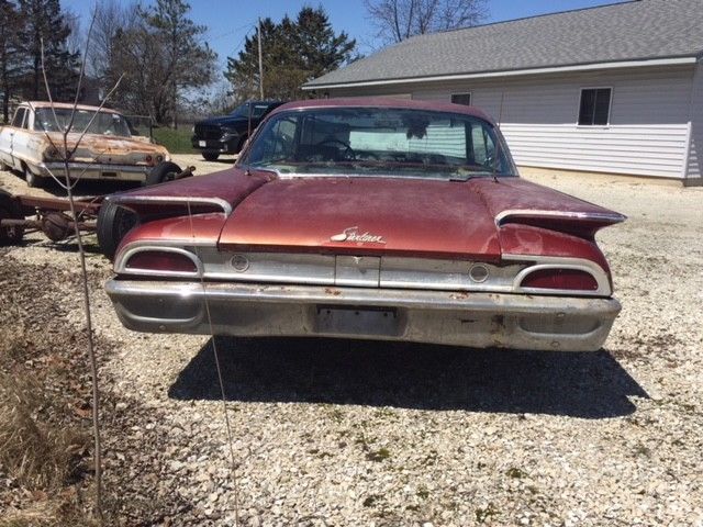 1960 Red Ford Starliner Coupe