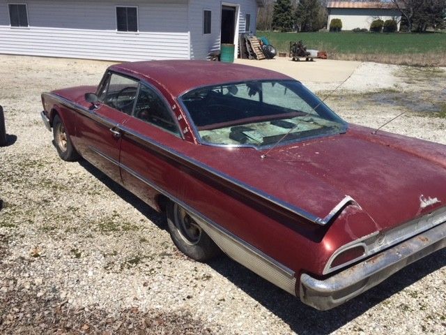 1960 Red Ford Starliner Coupe